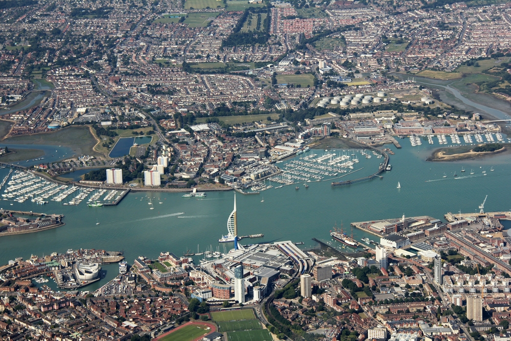 The Spinnaker Tower in Portsmouth, with the old Haslar submarine base, now a marina, at the far left on the other, Gosport, side of the harbour 
					entrance, and the old Camper & Nicholson marina, now just called Gosport Marina, to the right of the top of the Spinnaker Tower.