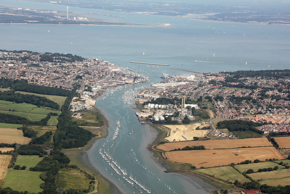 The River Medina and Cowes from the south. Calshot Tower and Spit on the mainland beyond the Solent, with Southampton Water at the top left, and 
					the River Hamble at top right.