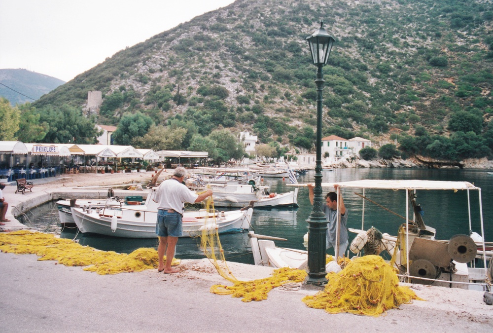 Fishermen sort out their nets at Frikes, Ithaca.