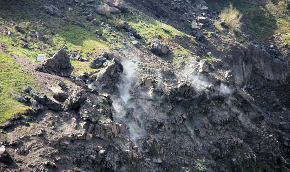 Steam seeping from vents in the crater show that the volcano is merely sleeping.