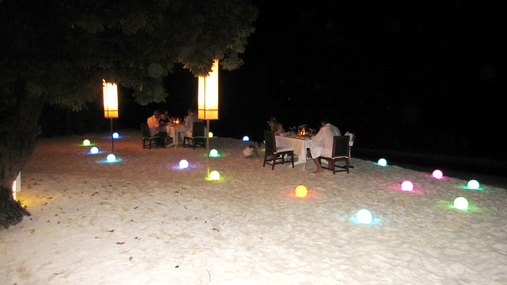 You can choose to dine under the stars on the beach. The lighted spheres on the sand continually change colour, creating a magical effect.
