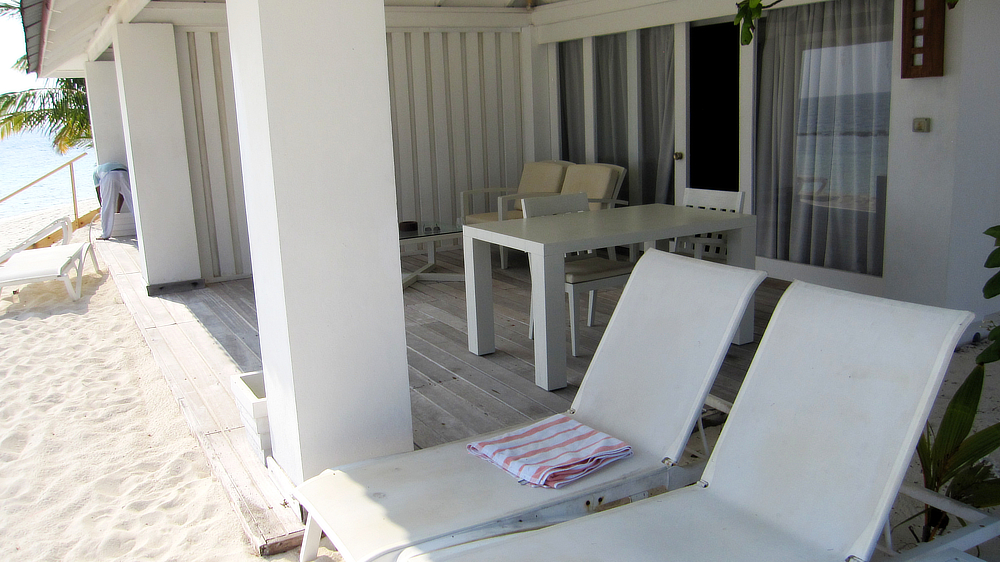 Sunbeds, a dining table and chairs, comfy easy chairs and a coffee-table on the deck.