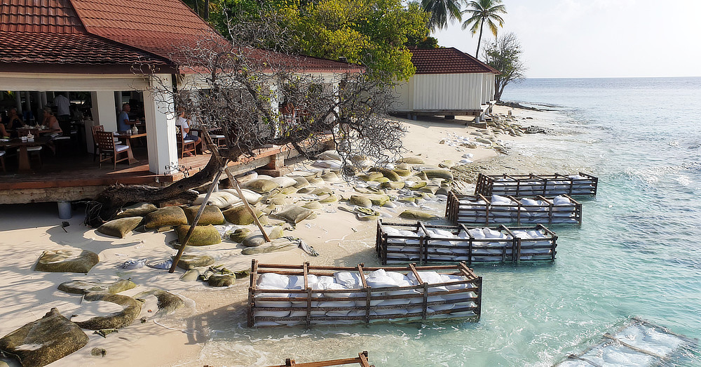 Unsightly mess of sandbags to protect the restaurant from being washed away. Compare with the next photo in mid-January 2020...