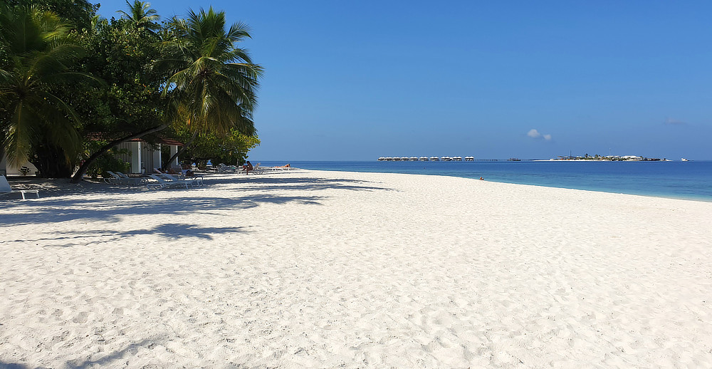 Choose your room carefully in order to get an enormous beach like this. Innafushi island, still a building site, in the distance.