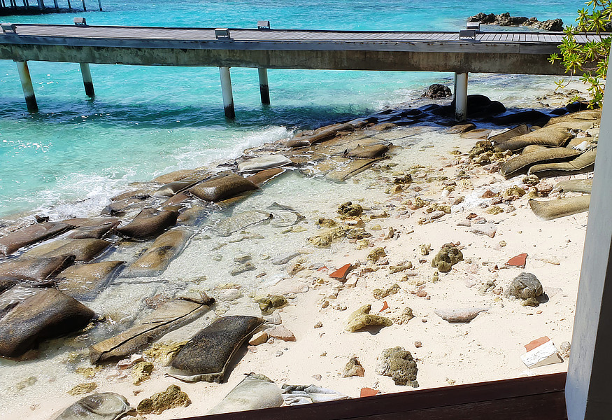 The water villa jetty from the main bar.