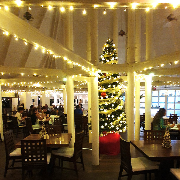 Christmas tree and lights up in the main restaurant. Each table has a miniature tree, made with sea-shells.