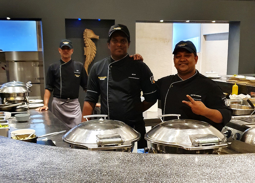 The live cooking counter, where these chefs cook your meal fresh before you.