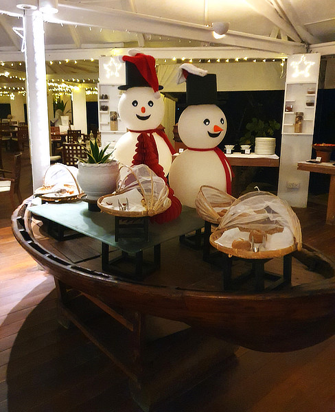 Seasonal snowmen guard the bread counter.